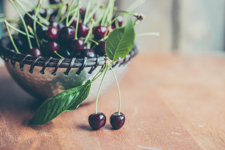 Cherries on wooden background