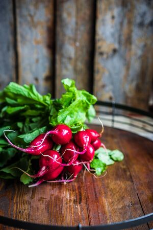 Radishes on wooden backgroundの写真素材