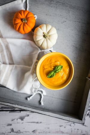 Pumpkin soup on rustic backgroundの写真素材