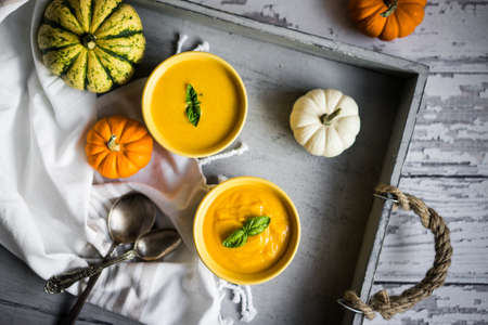 Pumpkin soup on rustic backgroundの写真素材