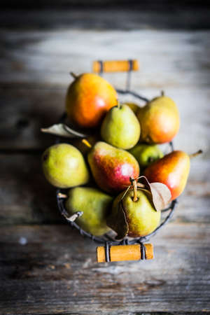 Autumn pears on rustic wooden backgroundの写真素材