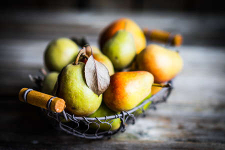 Autumn pears on rustic wooden backgroundの写真素材
