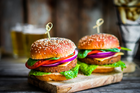 Homemade burgers on rustic wooden backgroundの写真素材