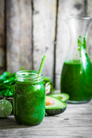 Green smoothie on rustic wooden backgroundの写真素材