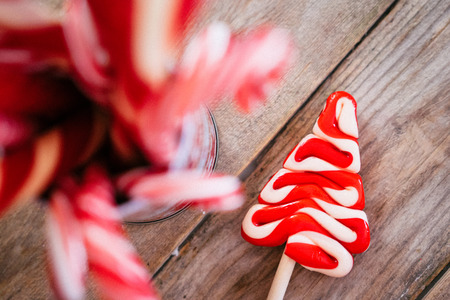 Christmas candy canes on wooden backgroundの写真素材