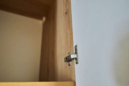 Furniture hinge. Metal furniture hinge. Close up photoの写真素材