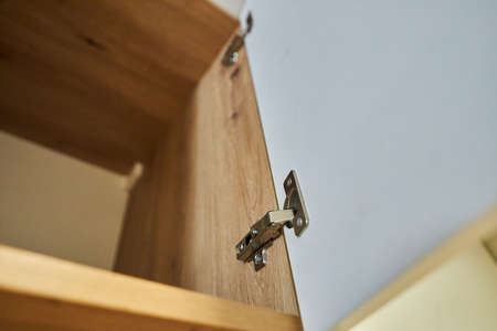 Furniture hinge. Metal furniture hinge. Close up photoの写真素材