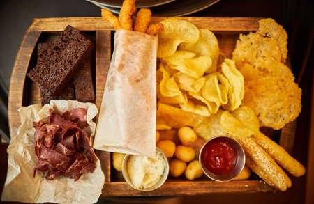 Tray with snacks for beer in a restaurantの写真素材