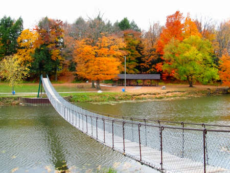 Swinging footbridge beckons to the adventurous pedestrian  の写真素材