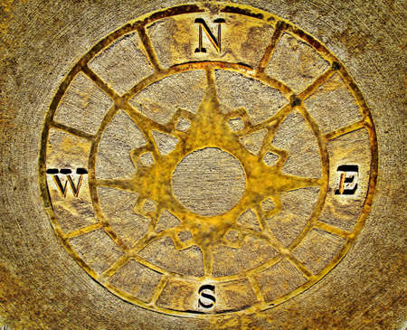 Golden Compass  Compass inlaid along a labrynith path to help young explorers find their way  Goodells County Park  St  Clair County, Michigan の写真素材