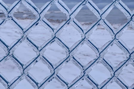 Frozen chain link fence background の写真素材