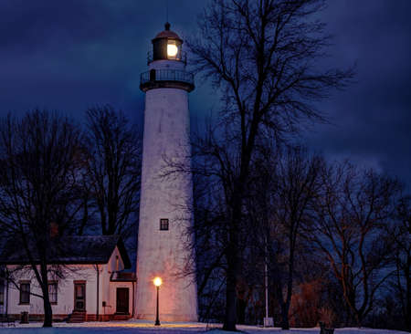 Point Aux Barques Lighthouse beacon lights up the cold and lonely winter s night  Lighthouse Park  Port Hope, Michigan の写真素材