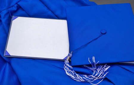 Cap, gown, and blank diploma with copy space for your congratulatory message or invitation  の写真素材
