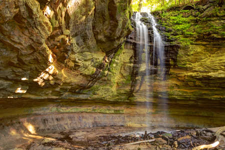 Beautiful Tannery Falls flows over a sandstone cliff  Munising, Michigan  の写真素材