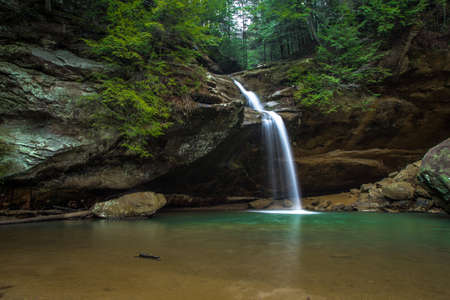 Waterfall In Paradise. Cascade along a hiking trail in Hocking Hills State Park. Logan, Ohio.