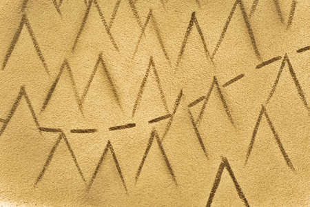 Petroglyph Background. Group of teepees with a line representing a trail.の写真素材