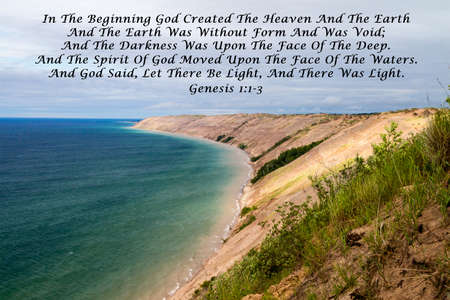 In The Beginning. Quote from the book of scriptures with a large Great Lakes sand dune as the background.の写真素材