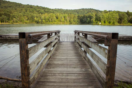 Lazy Summer Day. Wooden dock overlooking a mountain lake. Grayson State Park. Grayson Kentucky.