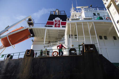 Sault Ste. Marie, Michigan, USA - May 31, 2014. Crew member waits as the ocean freighter Pilica makes it way through the American side of the Soo Locks. The Pilica's home port is Valletta, Malta.のeditorial素材