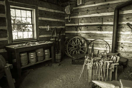 Copper Harbor, Michigan, USA - August 24, 2013. Interior of a blacksmith shop at Fort Wilkins State...