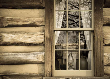 Log cabin window and exterior wall.