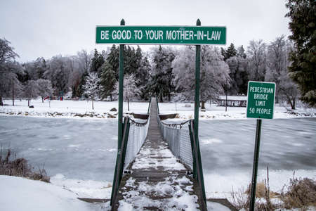The Swinging Bridge. The swinging footbridge also known as the, \"Mother-n-Law,\" bridge is the longest swinging footbridge in the state of Michigan and is located in Croswell, Michigan.の写真素材