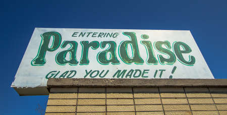 Paradise, Michigan, USA - May 7, 2016: Welcome sign for the small village of Paradise, Michigan. This small town lies on the shores of Lake Superior and has an approximate population of 500.のeditorial素材