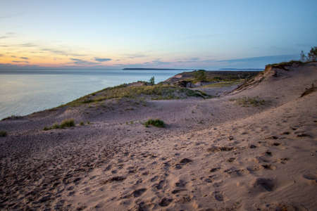 Sleeping Bear Dunes National Lakeshore. Massive sand dune at sunset on the shores of Lake Michigan in the Sleeping Bear Dunes National Lakeshore in Michigan.の写真素材