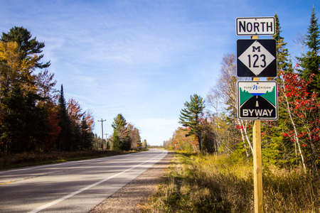Paradise, Michigan, USA - October 19, 2017: Road sign for M 123 in the Upper Peninsula. The highway is designated as a Pure Michigan Scenic Byway and is part of the scenic Lake Superior Circle Tour.のeditorial素材