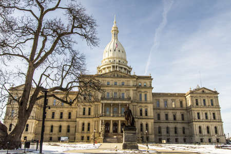 Michigan State Capitol Building. Exterior of the Michigan state capitol building and lawn in downtown Lansing, Michigan.のeditorial素材