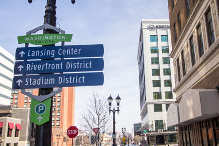 Lansing, Michigan, USA - January 20, 2018: Directional sign for the tourist district of downtown Lansingのeditorial素材