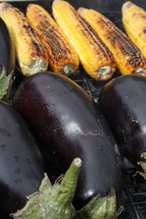 Barbecuing vegetables on charcoal fire closeup image.の写真素材