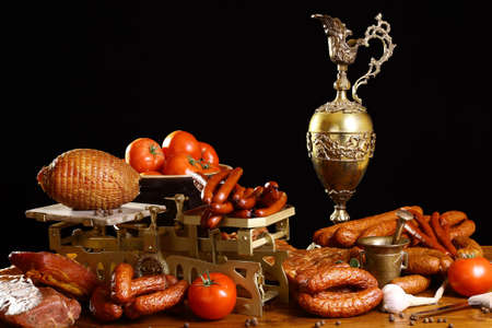 Many kinds of meat with antique pitcherの写真素材