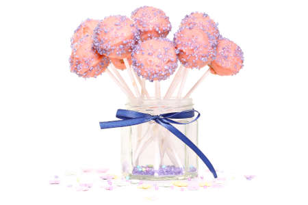 Cake pops in a jar on a white backgroundの写真素材