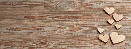 Different size heart figures on wooden backgroundの写真素材