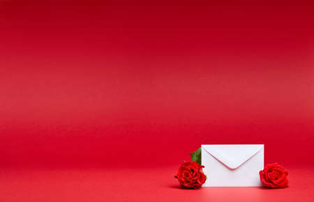 Red background with message and rosesの写真素材