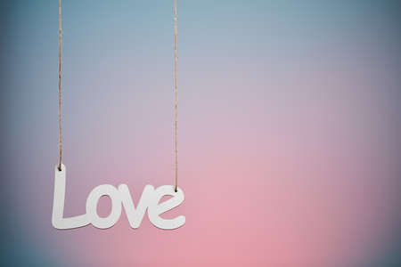 White love sign hanged on blue backgroundの写真素材