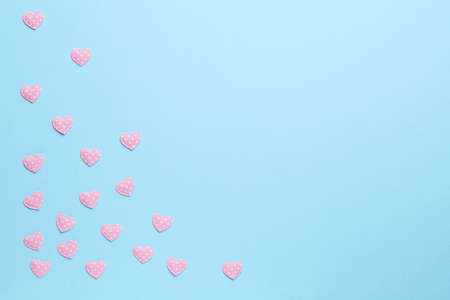 Pink hearts on blue backgroundの写真素材
