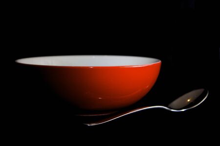 Red Bowl and Silver Spoonの写真素材