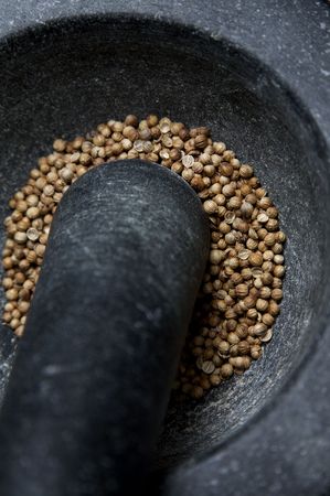 pestle and mortar with herbs and spices, peppercornの写真素材