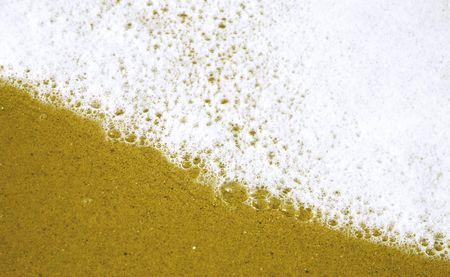 Water rushing over sandの写真素材