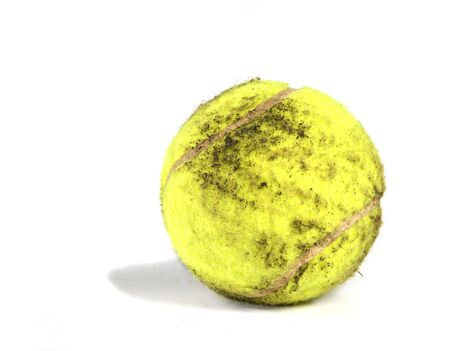 Muddy tennis ballの写真素材