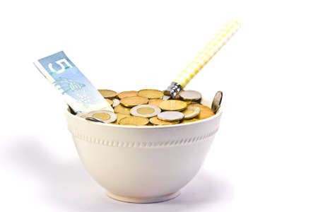 Hungry for Cash?? A cereal bowl filled with moneyの写真素材