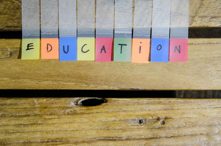 Education alpabet on wood pattern backgroundの写真素材