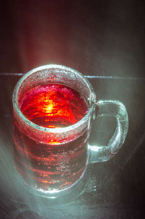 Abstract  red glass  with water sprayの写真素材