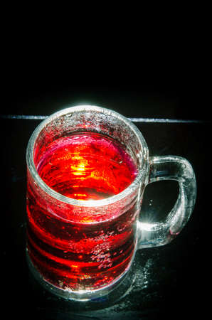 Abstract  red glass  with water sprayの写真素材