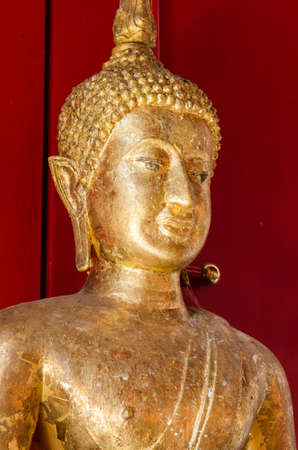 Golden buddha statue at the temple in thailandの写真素材