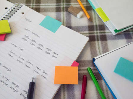Learning other language writing words on the notebookの写真素材