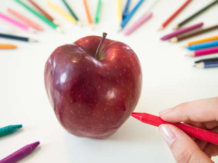looks like drawing apples with the colorful crayonの写真素材