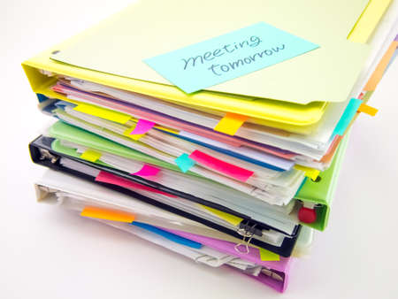 There is the huge pile of business documents on the desk.の写真素材
